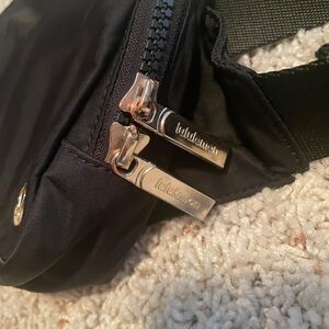 Black Lululemon Everywhere Belt Bag 2L with gold zippers